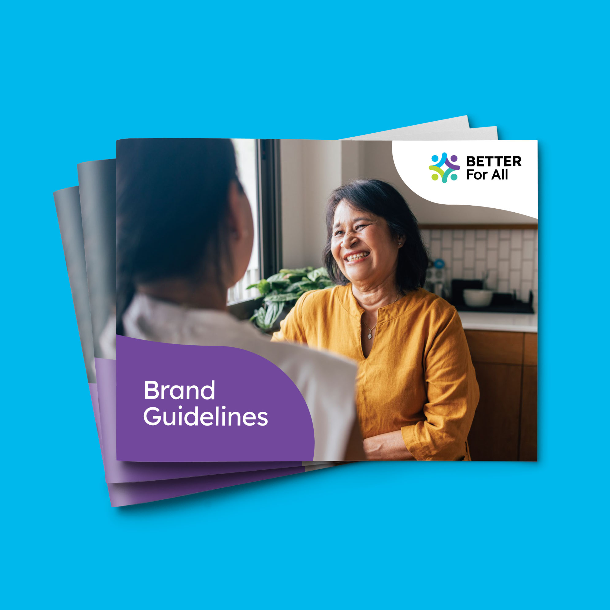 Cover of the Better For All brand guidelines booklet featuring the logo and a photo of two people talking in a kitchen, with a purple brand element framing the title.
