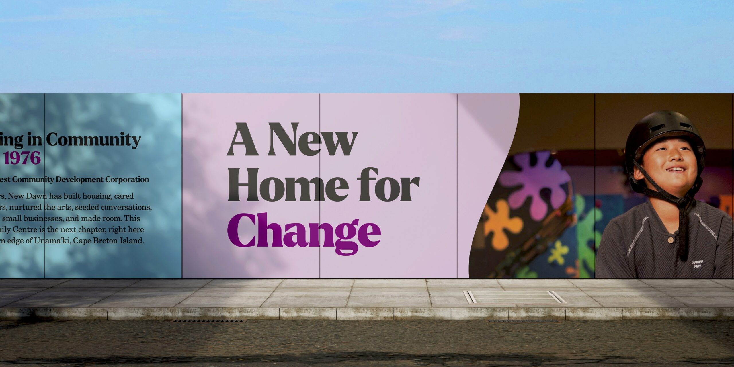 Large-scale Change Starts Here campaign signage installed along the New Dawn Youth and Family Centre construction site fencing in Glace Bay.