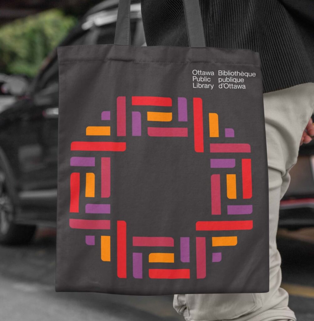Canvas tote bag featuring Ottawa Public Library's new logo designed by Intent