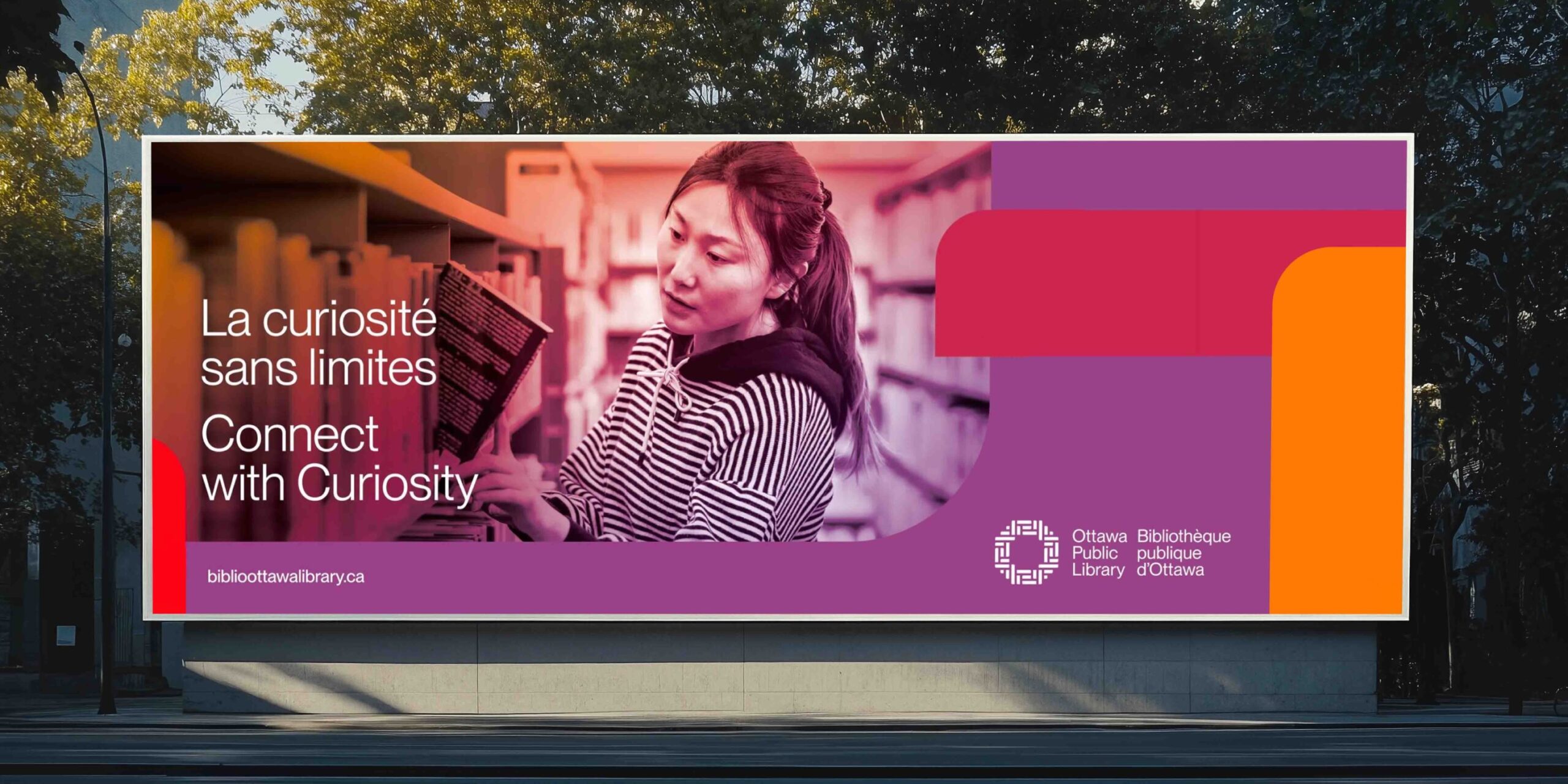 Roadside billboard displaying Ottawa Public Library campaign messaging and visual identity developed by Intent